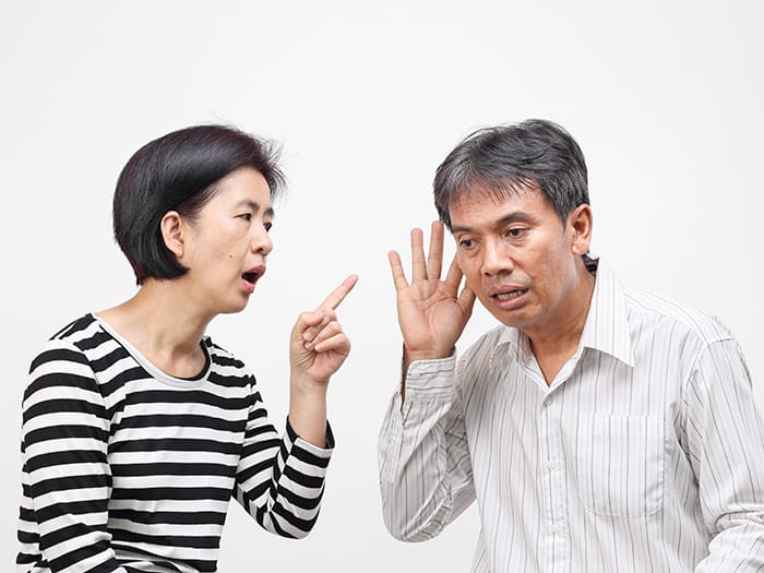 Husband trying to hear his wife